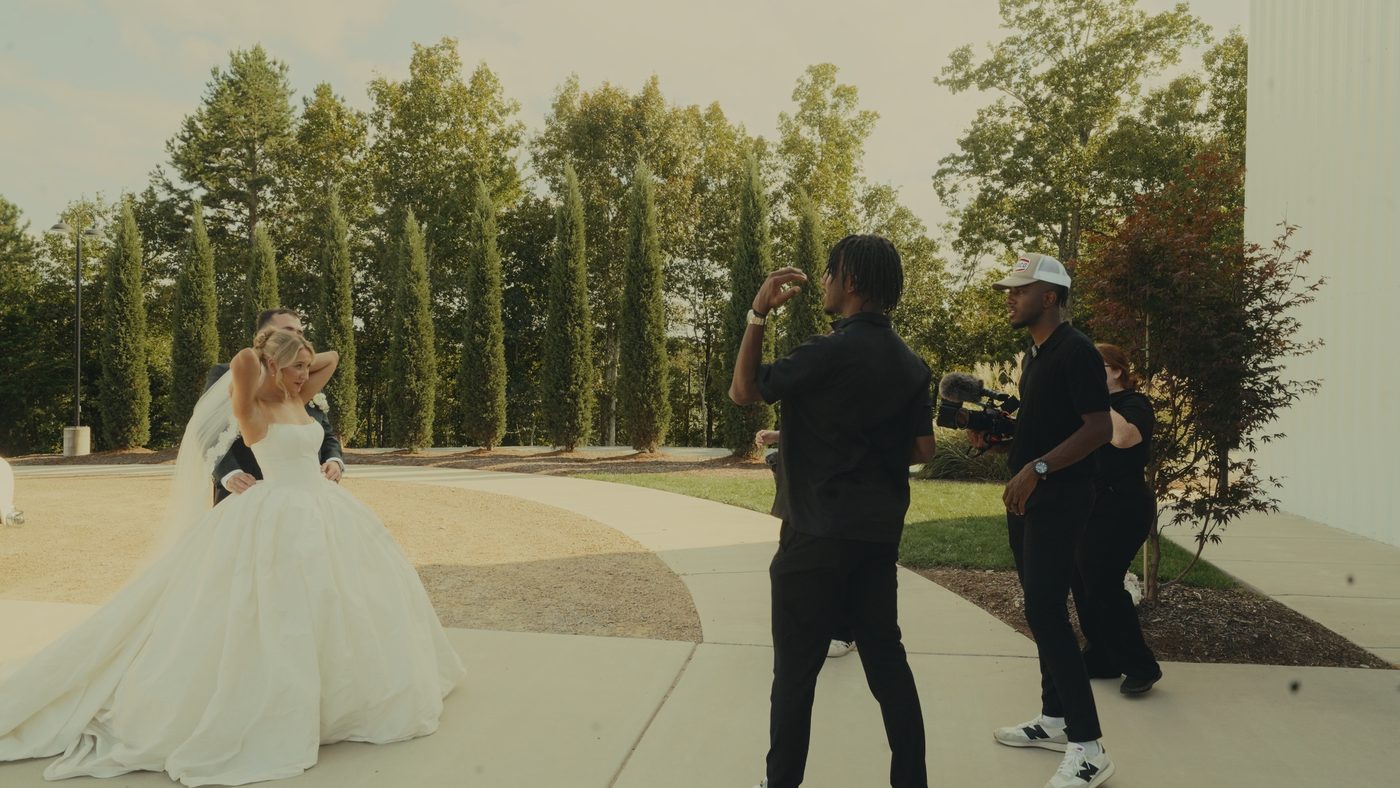 Tim and Timmy filming a bride and groom